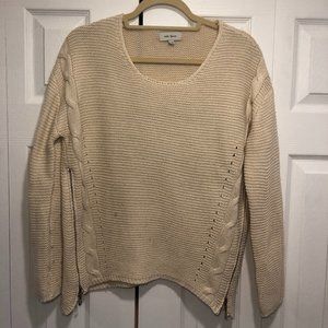 Cream sweater with gold side zippers
